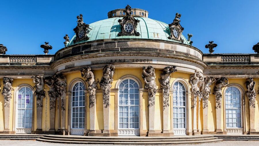 Elegant Sanssouci Palace facade with detailed sculptures in Potsdam