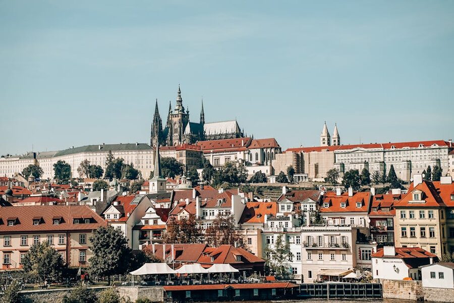 Prague Castle and Mala Strana red rooftops viewed from the river