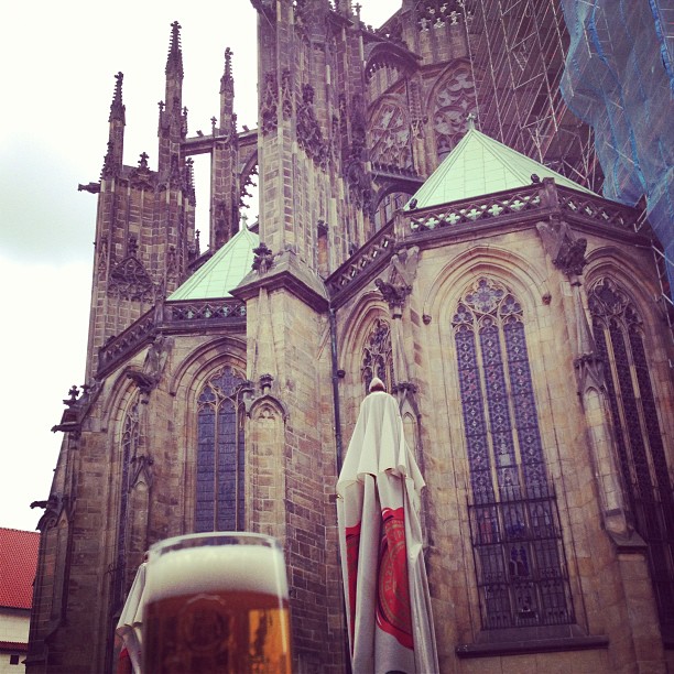 Pilsner Urquell beer in front of St Vitus Cathedral Prague