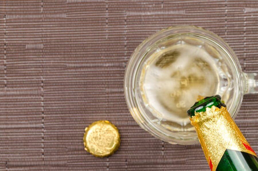 Beer poured into glass mug overhead view