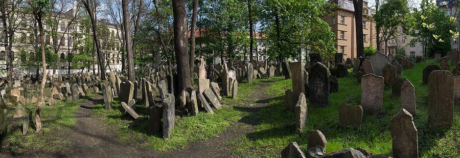 Old Jewish Cemetery in Prague's Josefov district with stacked tombstones