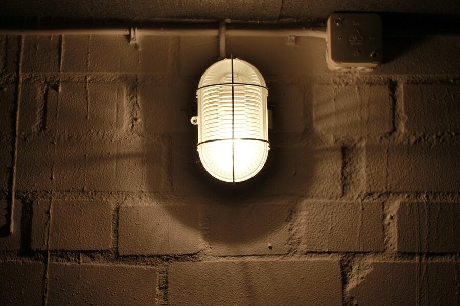 Old basement with stone walls and lamp