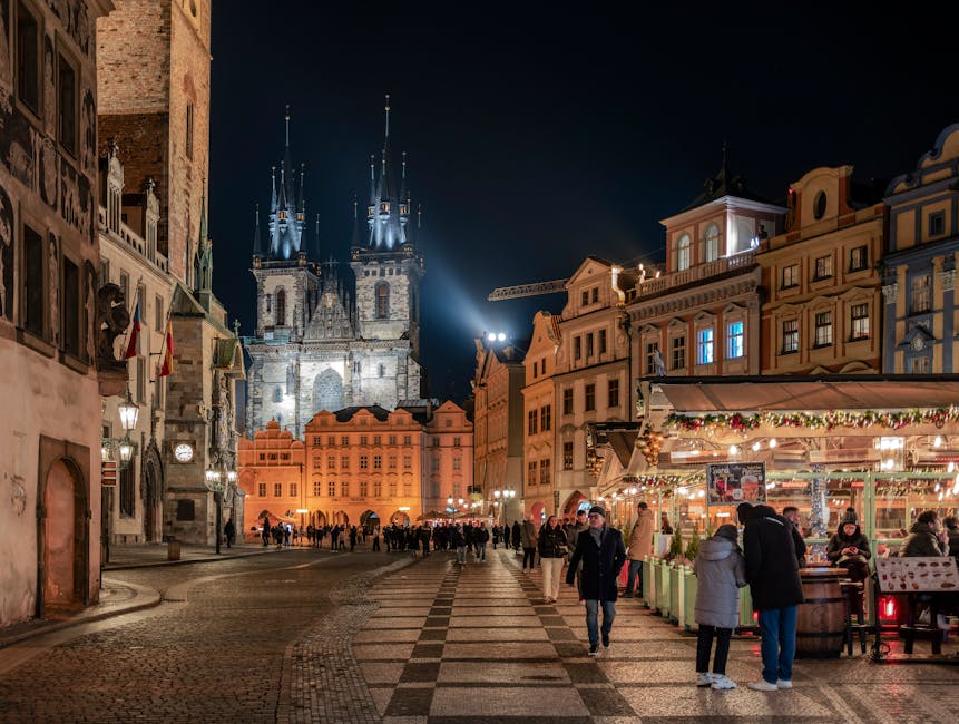 Prague Old Town Square at night with Tyn Church illuminated
