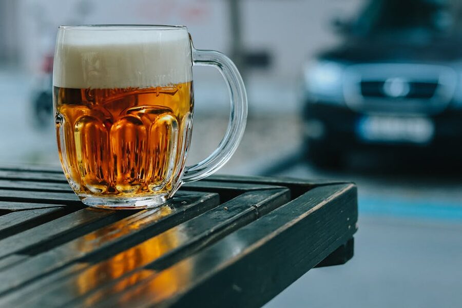 Frosty pilsner glass at a Prague beer garden table