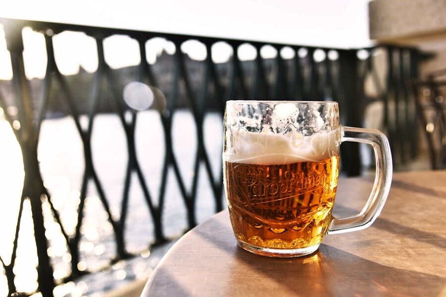 Pilsner lager mug outdoors in Prague with a river view