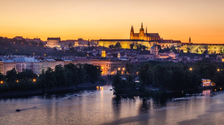 Prague Castle at sunset over the Vltava during a cruise