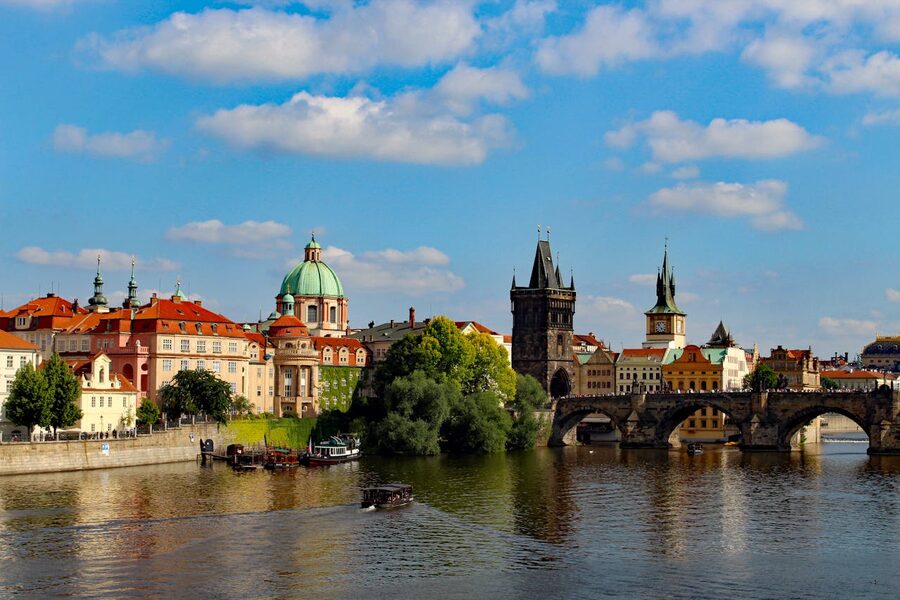 Charles Bridge with Prague Castle and the riverside skyline above the Vltava