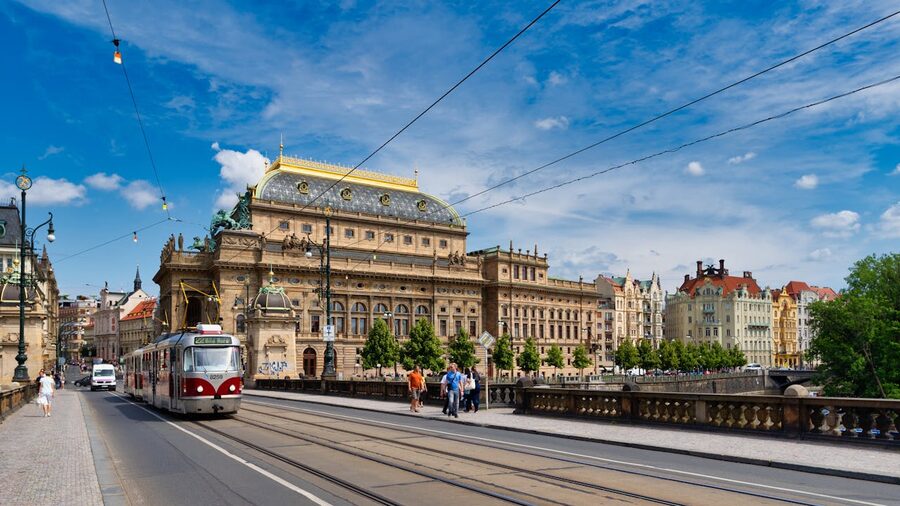 Prague National Theatre on the Vltava embankment seen from a cruise boat