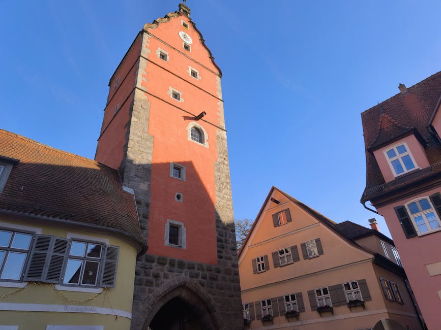 Historical tower and charming buildings in Rothenburg on a sunny day