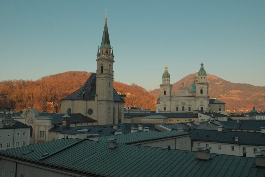 Salzburg skyline with churches and rooftops at sunset