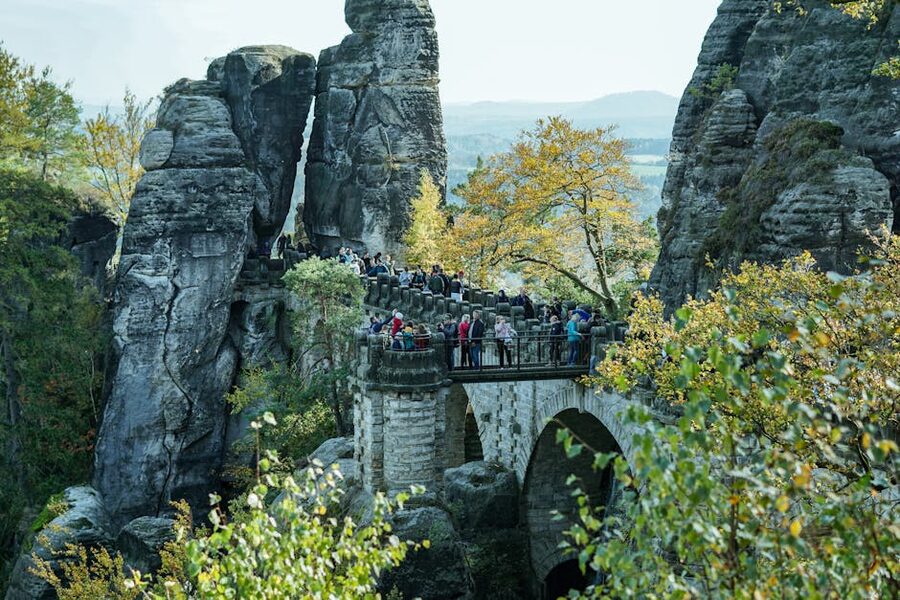 Tourists crossing Bastei Bridge in autumn