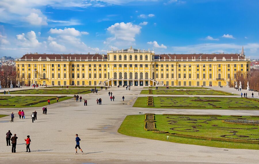 Schonbrunn park with visitors walking the central avenue