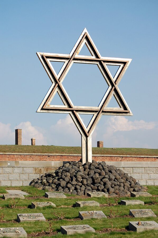 The Star of David monument and headstones at Terezin National Cemetery