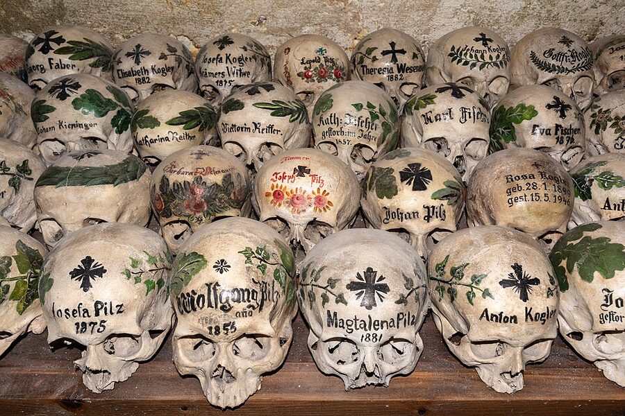 Painted skulls inside the Hallstatt Karner Bone House