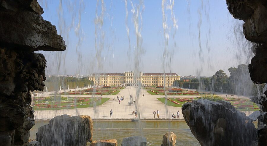 Schonbrunn Palace exterior viewed from Neptune Fountain Vienna