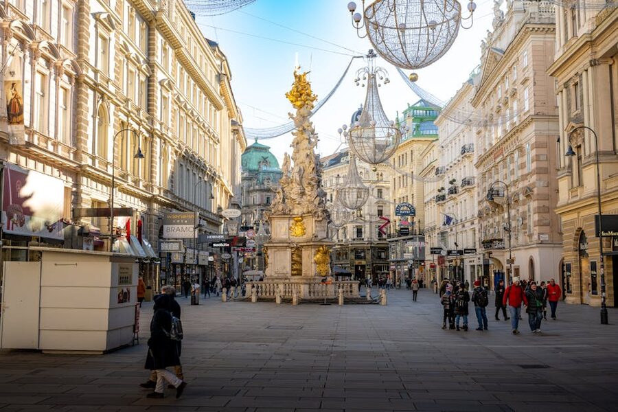 Plague Column on Graben Street, Vienna, with crowds in the background