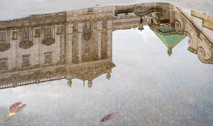 Hofburg palace southeast facade reflected in Burggarten pond