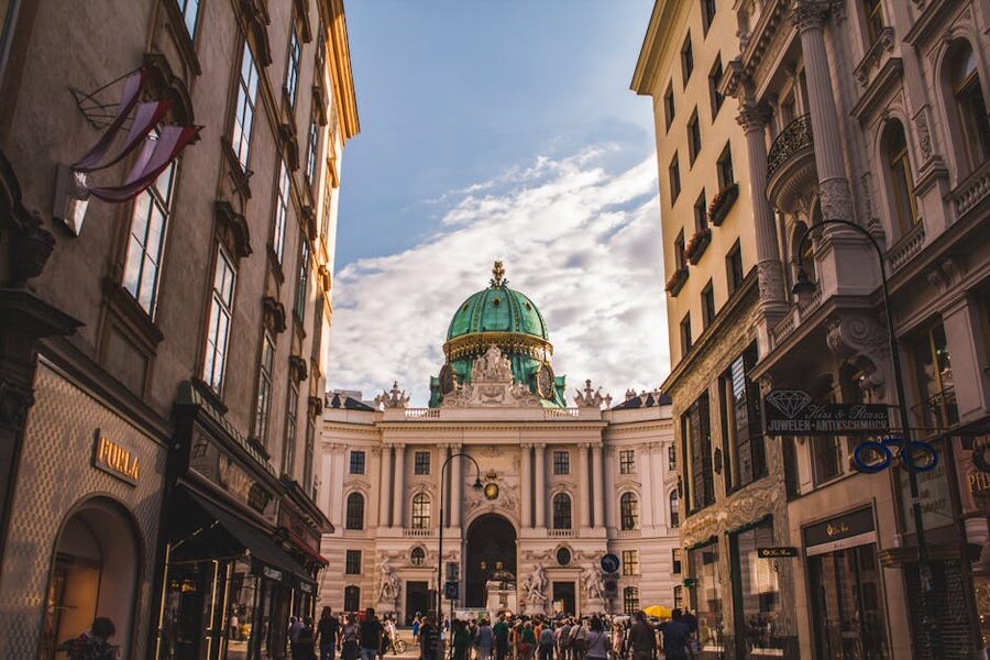 People walking on the street toward Hofburg Palace in Vienna