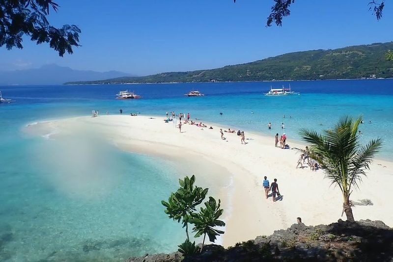 2 Day South Cebu Highlights Tour - Day 1: Oslob, Tumalog Falls and Sumilon Sand Bar