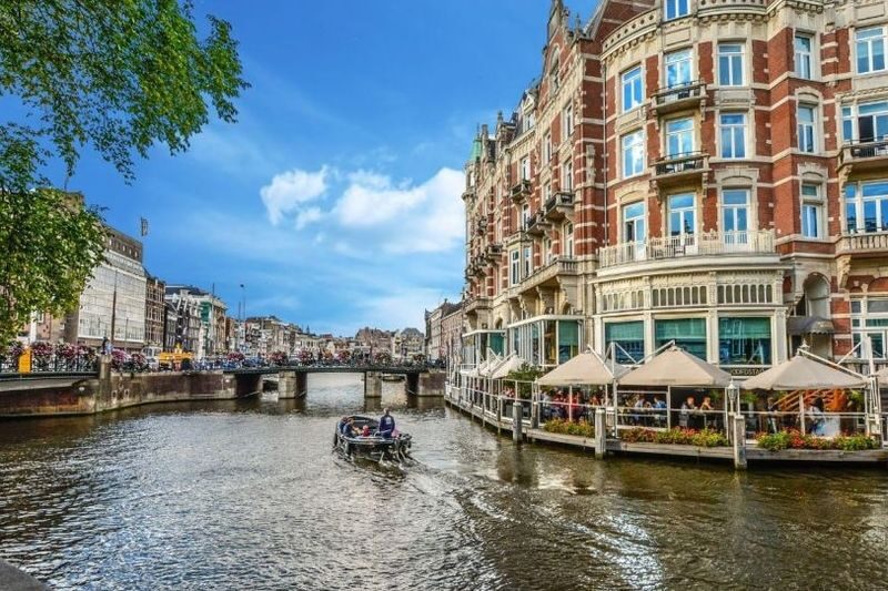 Amsterdam Canal Cruise: Electric Boat with Panorama Glass Rooftop - One hour on the water, with room to look around