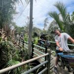 Bangkok Green Oasis Nature Bike Tour with Local Lunch - A temple stop with a giant Ganesha