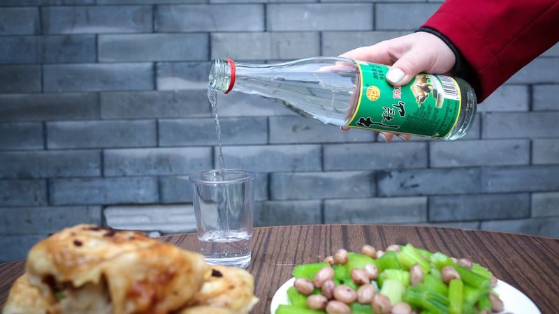 Beijing Drum Tower Half-Day Local Food Walking Tour - Hotpot, pancakes and a shot of baijiu