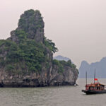 Binh An Day Cruise: Ha Long Bay with Sung Sot and Ti Top - Cruising between Ha Long Bay’s karsts