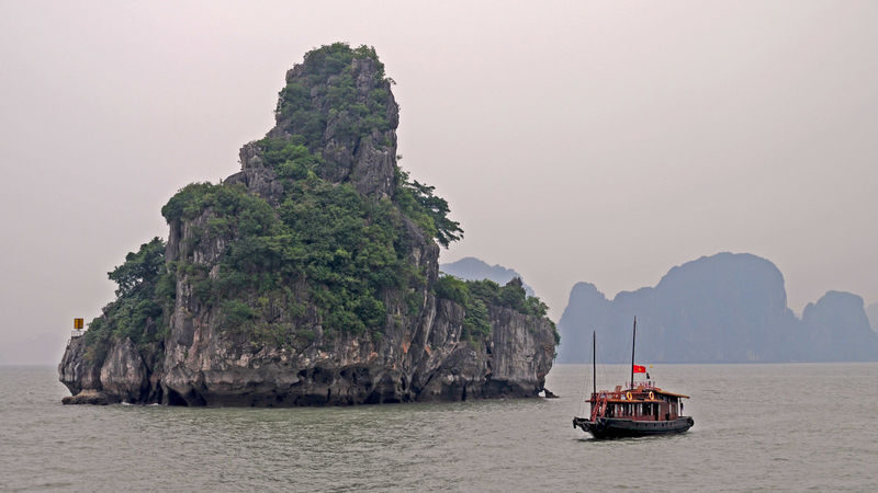 Binh An Day Cruise: Ha Long Bay with Sung Sot and Ti Top - Cruising between Ha Long Bay’s karsts
