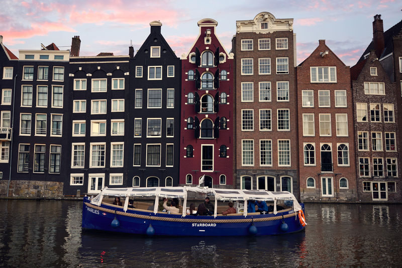 Canal Booze Cruise with Unlimited Drinks Option in Amsterdam - One Hour Through the Canals and Under Seven Bridges