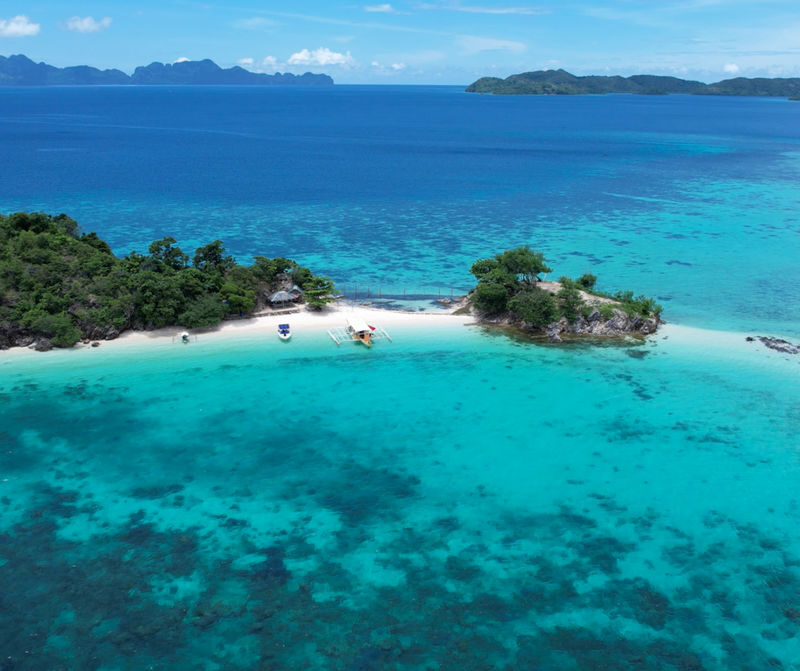 Coron Island Escapade Malcapuya (2 White Sand Island and 1 Sandbar) - Malcapuya: the beach that earns the boat ride