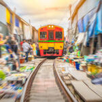 Damnoen Saduak Floating Market with Rowboat Ride + Train Ride at Maeklong Railway Market Tour by Panda Bus (LMK2) - The Maeklong train ride and market passage