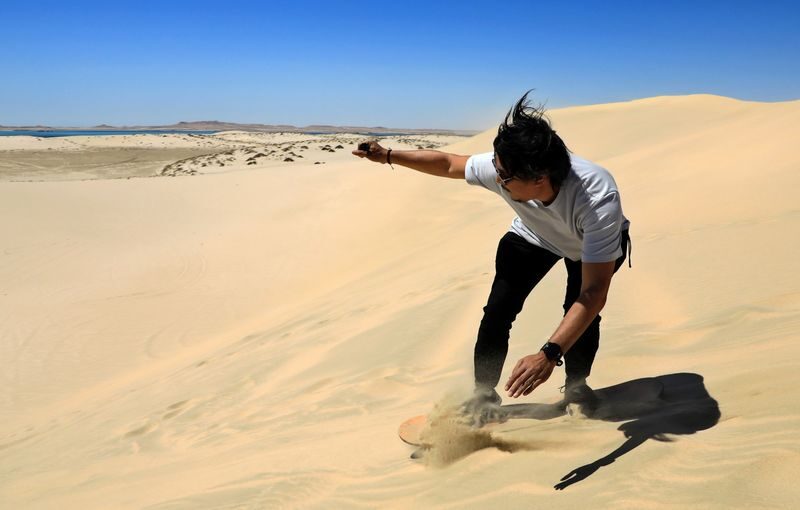 Doha Half-Day Desert Safari & Inland Sea Experience - Sandboarding: fun on the way down
