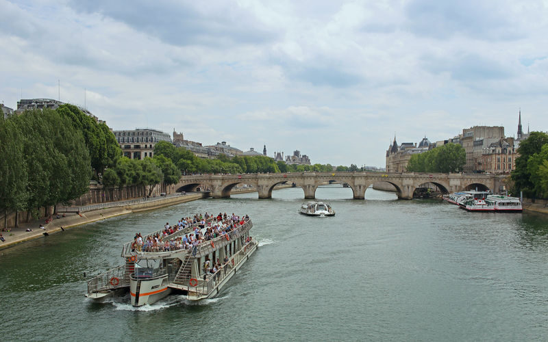 Eiffel Tower Guided Tour with Seine River Cruise - Walking into the Eiffel Tower with a guide