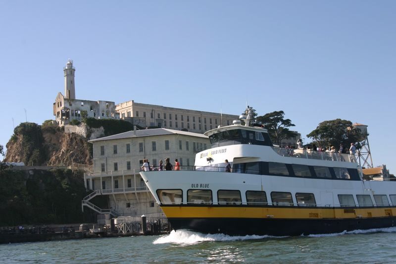 Escape from the Rock Cruise around Alcatraz Island - Alcatraz from the water, with stories attached