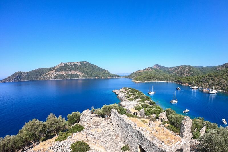 Fethiye 12 Islands Full-Day Guided Boat Tour - Flat Island and Dockyard Island bring a bit of history