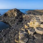 Giants Causeway, Dunluce Castle & Dark Hedges Tour from Belfast - Dunluce Castle above the sea