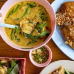 Half-Day Hidden Gems Food Experience - Riding between restaurants by Songthaew