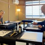 Hands-on Zen Calligraphy & 150-Year-Old Kyoto Machiya Tour - Grinding ink before making a mark