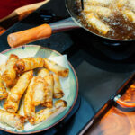 Hanoi Vegetarian Cooking Class: Free Wine Tasting & Recipe Book - A shared table and a little local wine