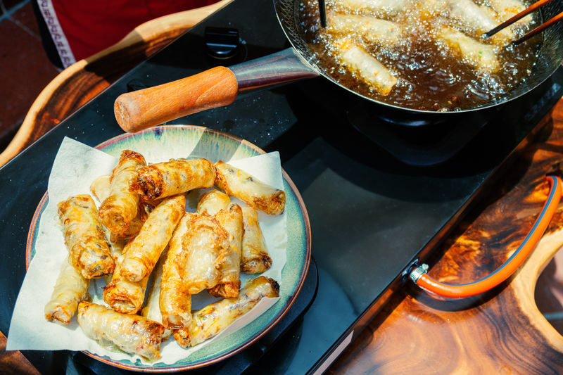 Hanoi Vegetarian Cooking Class: Free Wine Tasting & Recipe Book - A shared table and a little local wine