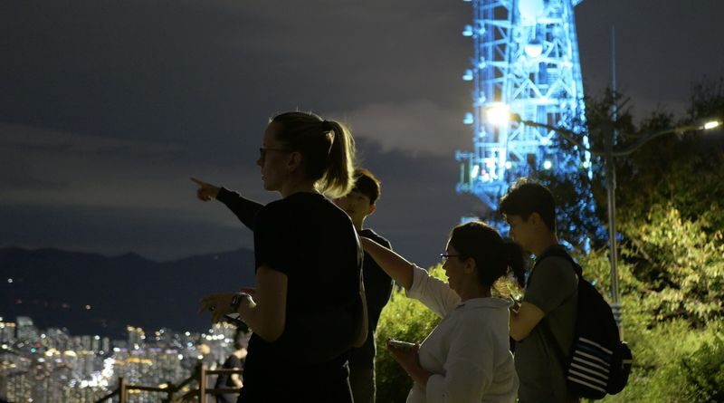 Hiking Up Busan: The Best Night View Small Group Tour - Following the mountain paths after dark