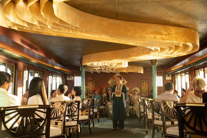 Hue: Perfume River Dining Cruise Experience By Hueritage Cruise - Reading Hue from the water