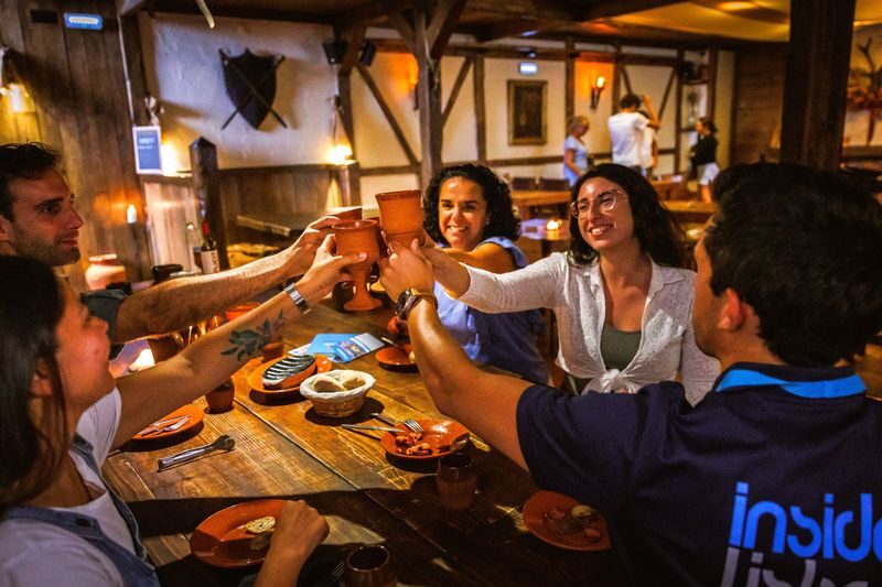 Lisbon Food and Wine Walking Tour - Codfish cake, green wine, and Portuguese small plates