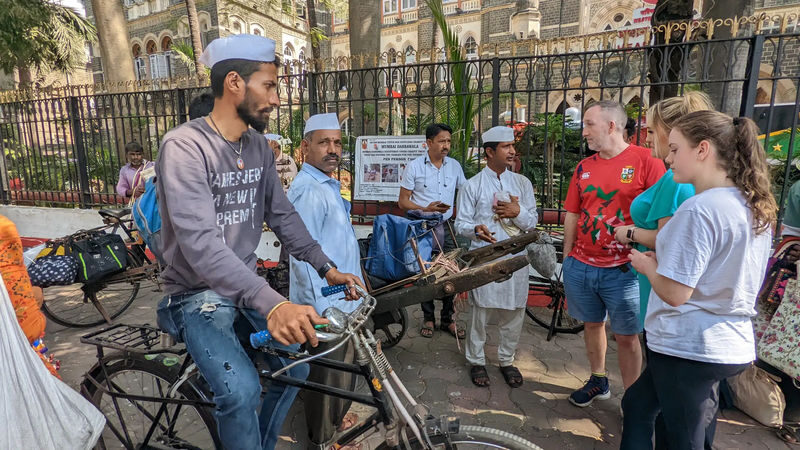 Mumbai Half Day Tour - Dharavi, Dhobighat and Dabbawallas - Riding local trains is part of the lesson