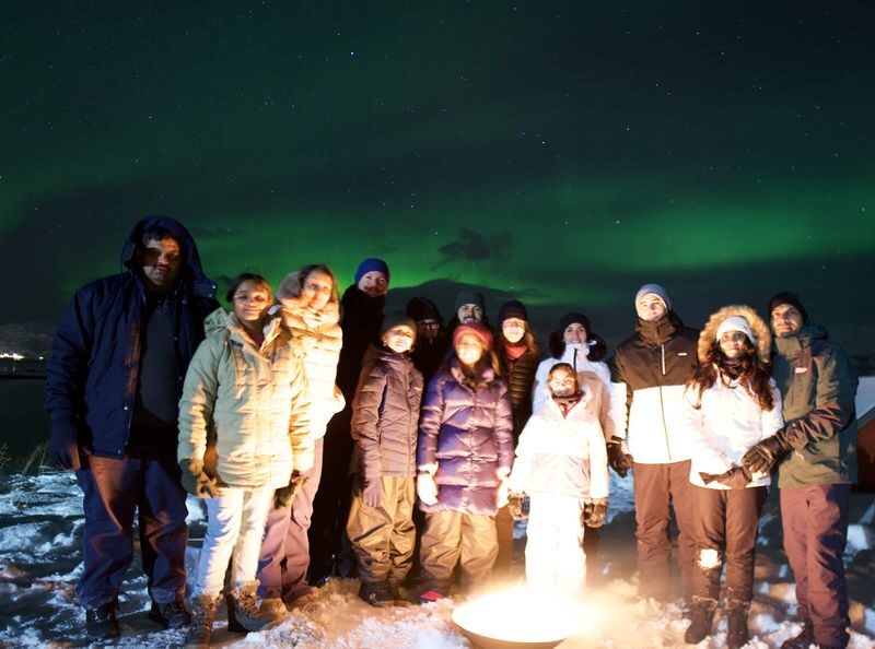 Nothern Light Chase from Tromso with Minibus - A guide, a driver, and the camera