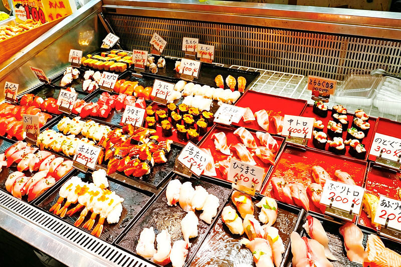 One-day tour experience of Motonosumi Shrine and Mount Sarakura - Karato Market: fresh seafood, with a clock running