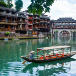 One-Day Tour to Phoenix Ancient Town from Zhangjiajie - Seeing the stilt houses from the Tuo River