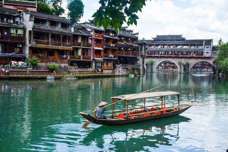 One-Day Tour to Phoenix Ancient Town from Zhangjiajie - Seeing the stilt houses from the Tuo River