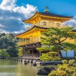 Osaka & Kyoto Scenic Spots One-Day Tour: Katsuoji Temple Prayer & Kinkaku-ji Temple Pilgrimage & Arashiyama Togetsukyo Bridge & Kimono Forest & Bamboo Grove Path & Nonomiya Shrine (Departing from Osaka or Kyoto) - Arashiyama’s bridge, bamboo and bright kimono pillars