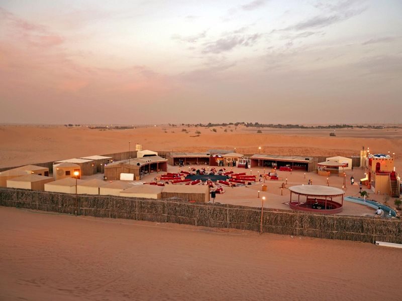 Premium Desert Safari - Morning, Evening & Overnight at Al Khayma - Sandboarding and a camel ride on the sand
